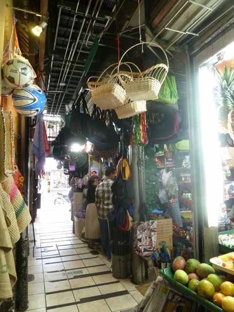 Corridor with baskets and fruit at Mercado Central